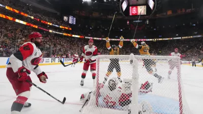 Carolina Hurricanes left wing Jordan Martinook (48) reacts after Vegas Golden Knights defenseman Shea Theodore scored during the the second overtime in Game 3 of the NHL hockey Stanley Cup Final series, Saturday, June 6, 2026, in Las Vegas. (AP Photo/Candice Ward)
