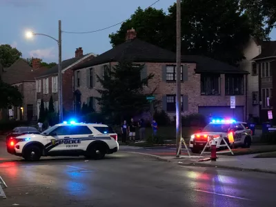 Police stand near where multiple people were shot at a community festival at the Agnes Reynolds Jackson Arboretum Saturday, June 6, 2026, in Toledo, Ohio. (AP Photo/Paul Sancya)