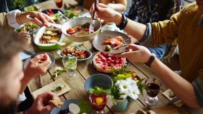 People sitting at dining table and eating