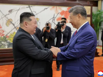 FILE PHOTO: North Korean leader Kim Jong Un and Chinese President Xi Jinping shake hands on the day of their bilateral summit in Beijing, China, September 4, 2025, in this picture released by North Korea's official Korean Central News Agency.  KCNA via REUTERS ATTENTION EDITORS - THIS IMAGE WAS PROVIDED BY A THIRD PARTY. REUTERS IS UNABLE TO INDEPENDENTLY VERIFY THIS IMAGE. NO THIRD PARTY SALES. SOUTH KOREA OUT. NO COMMERCIAL OR EDITORIAL SALES IN SOUTH KOREA./File Photo