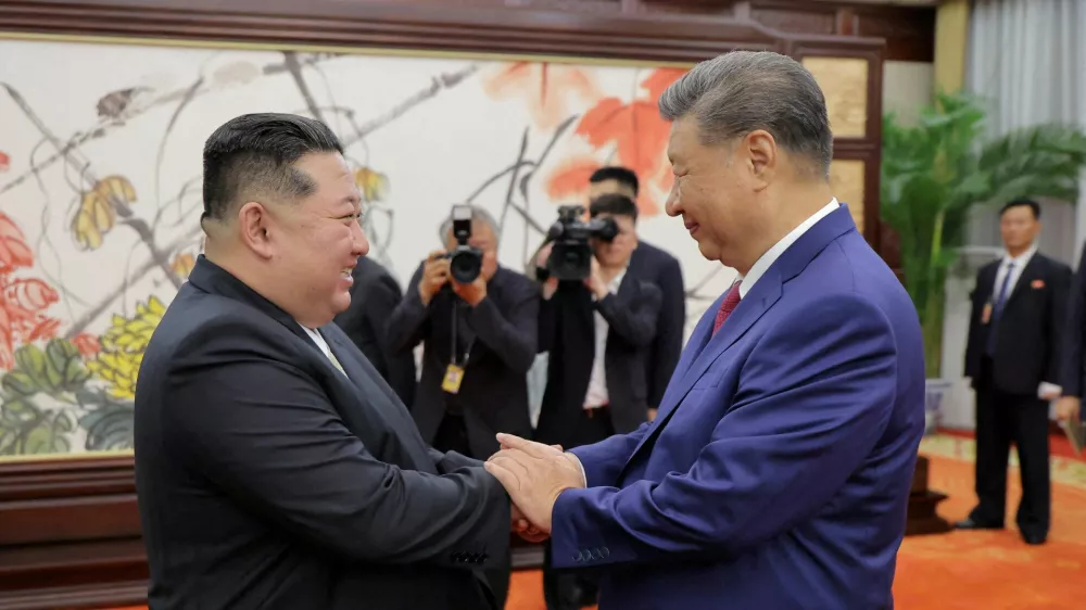 FILE PHOTO: North Korean leader Kim Jong Un and Chinese President Xi Jinping shake hands on the day of their bilateral summit in Beijing, China, September 4, 2025, in this picture released by North Korea's official Korean Central News Agency.  KCNA via REUTERS ATTENTION EDITORS - THIS IMAGE WAS PROVIDED BY A THIRD PARTY. REUTERS IS UNABLE TO INDEPENDENTLY VERIFY THIS IMAGE. NO THIRD PARTY SALES. SOUTH KOREA OUT. NO COMMERCIAL OR EDITORIAL SALES IN SOUTH KOREA./File Photo