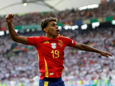 FILE PHOTO: Soccer Football - Euro 2024 - Quarter Final - Spain v Germany - Stuttgart Arena, Stuttgart, Germany - July 5, 2024 Spain's Lamine Yamal celebrates after Dani Olmo scores their first goal REUTERS/Heiko Becker/File Photo