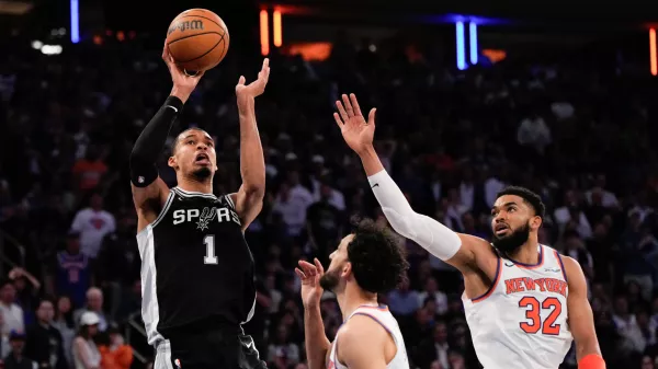 San Antonio Spurs forward Victor Wembanyama (1) shoots over New York Knicks center Karl-Anthony Towns (32) during second half of Game 3 of the NBA Finals basketball series, Monday, June 8, 2026, in New York. (AP Photo/Ross D. Franklin)