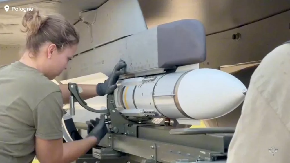 A member of personnel works after the French armed forces mobilised three Rafale fighter jets following the launch of the Eastern Sentry operation to bolster the defence of NATO's eastern flank in response to Russian drone incursions into Polish airspace, in a location given as Poland in this screen grab from a handout video released on September 12, 2025. French Armed Forces/Handout via REUTERS THIS IMAGE HAS BEEN SUPPLIED BY A THIRD PARTY. NO RESALES. NO ARCHIVES. MANDATORY CREDIT
