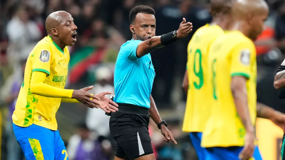 FILE - Referee Omar Artan, center, signals a penalty during the CAF Champions League final soccer match between AS FAR Rabat and Mamelodi Sundowns, in Rabat, Morocco, Sunday, May 24, 2026. (AP Photo/Mosa'ab Elshamy, File)