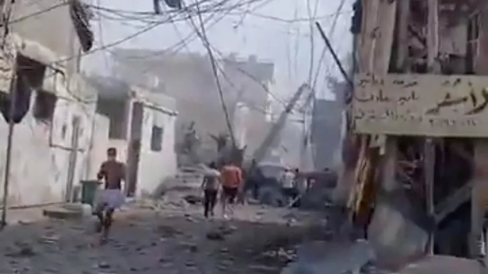 People inspect the damage in the aftermath of an Israeli strike, in Tyre, Lebanon, June 9, 2026, in this screen grab taken from a social media video. Social Media/via REUTERS THIS IMAGE HAS BEEN SUPPLIED BY A THIRD PARTY. NO RESALES. NO ARCHIVES. NEWS USE ONLY. VERIFICATION: - Buildings, road layout, power pylons and trees matched satellite imagery. - Coordinates: 33.26896776549794, 35.22009307638538. - Date verified by a report from the Lebanese National News Agency of airstrikes that hit several residential buildings in Tyre on the morning of June 9. - No older versions found posted online before June 9.