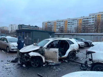This photo provided by Investigative Committee of Moscow on Monday, Dec. 22, 2025, shows an investigator working at the scene where Lt. Gen. Fanil Sarvarov, head of the Operational Training Directorate of the Russian Armed Forces General Staff, was killed by an explosive device placed under his car in Moscow. (Investigative Committee of Moscow via AP)