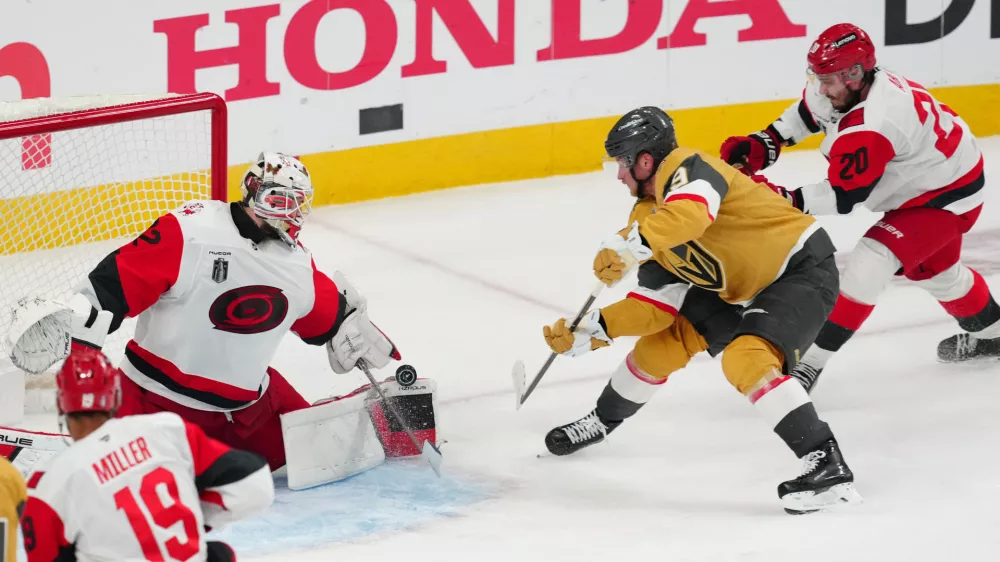 Jun 9, 2026; Las Vegas, Nevada, USA; Carolina Hurricanes goaltender Brandon Bussi (32) stops a shot by Vegas Golden Knights center Jack Eichel (9) during the 3rd period in game four of the 2026 Stanley Cup Final at T-Mobile Arena. Mandatory Credit: Stephen R. Sylvanie-Imagn Images