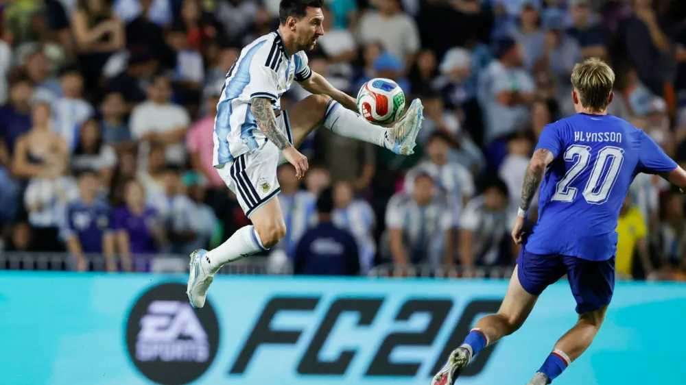 Argentina forward Lionel Messi (10) gets control of the ball as Iceland midfielder Kristian Hlynsson (20) defends during the second half of an international friendly match, Tuesday, June 9, 2026, in Auburn, Ala. (AP Photo/Butch Dill)