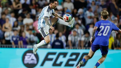 Argentina forward Lionel Messi (10) gets control of the ball as Iceland midfielder Kristian Hlynsson (20) defends during the second half of an international friendly match, Tuesday, June 9, 2026, in Auburn, Ala. (AP Photo/Butch Dill)