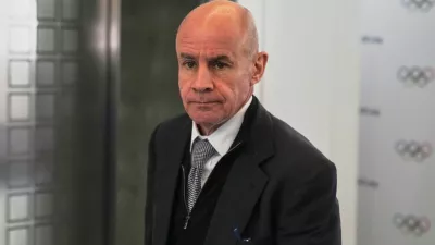 FILE - Candidate to the presidency of the International Olympic Committee Johan Eliasch arrives at the mixed zone during a break of the 144th session, which will elect the new IOC President, in Costa Navarino, western Greece, March 19, 2025. (AP Photo/Thanassis Stavrakis, File)