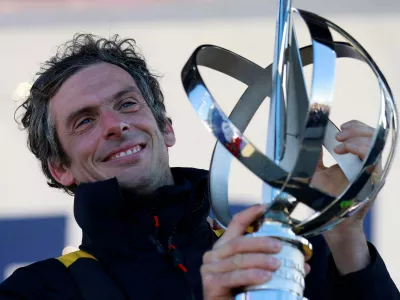 FILE PHOTO: Sailing - Arrival of the Vendee Globe winner - Les Sables-d'Olonne, France - January 14, 2025 Macif Sante Prevoyance's Charlie Dalin holds the trophy onstage as he arrives in port after winning the Vendee Globe REUTERS/Stephane Mahe/File Photo