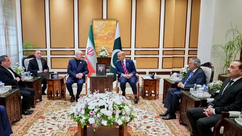 In this photo released by the Pakistan Prime Minister Office, visiting Iranian delegation headed by Iran's Parliament Speaker Mohammad Bagher Ghalibaf, third left, meet with Pakistani Prime Minister Shehbaz Sharif, in Islamabad, Pakistan, Saturday, April 11, 2026 (Pakistan Prime Minister Office via AP)