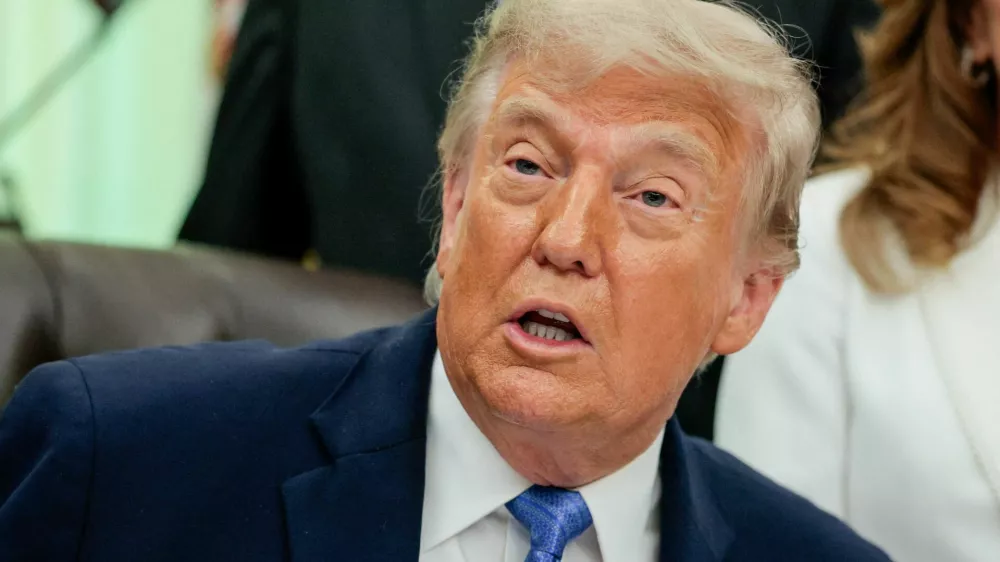 FILE PHOTO: U.S. President Donald Trump speaks in the Oval Office as he signs the Secure America Act, at the White House in Washington, D.C., U.S., June 10, 2026. REUTERS/Evan Vucci/File Photo