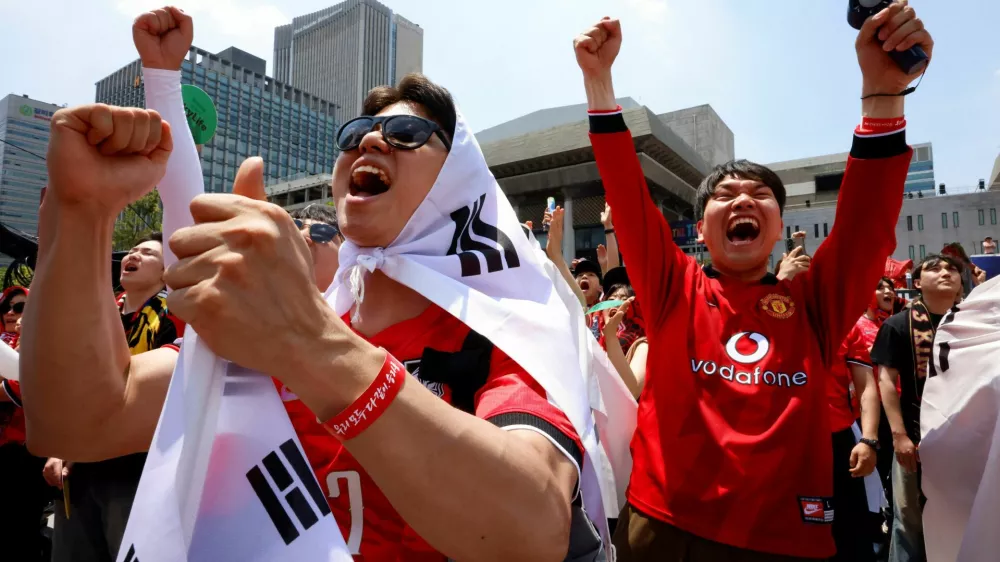 Fans cheer as they watch South Korea play the Czech Republic during their FIFA World Cup 2026 Group A match, at a public viewing event in Seoul, South Korea, June 12, 2026. REUTERS/Kim Soo-hyeon