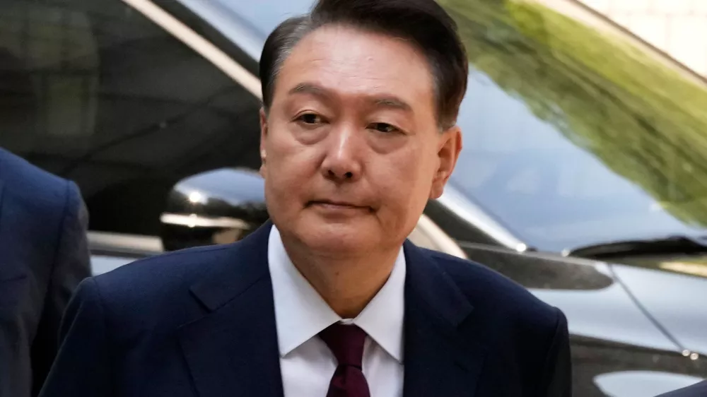 South Korea's ousted former President Yoon Suk Yeol arrives to attend his trial at the Seoul Central District Court in Seoul, South Korea, May 12, 2025. (AP Photo/Ahn Young-joon, Pool, File)