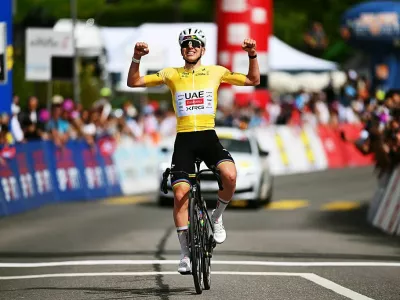 CHARMEY, SWITZERLAND - MAY 02: Tadej Pogacar of Slovenia and UAE Team Emirates - XRG - Yellow Leader Jersey celebrates at finish line as stage winner during the 79th Tour de Romandie 2026, Stage 4 a 149.6km stage from Broc to Charmey / #UCIWT / on May 02, 2026 in Charmey, Switzerland. (Photo by Dario Belingheri/Getty Images)