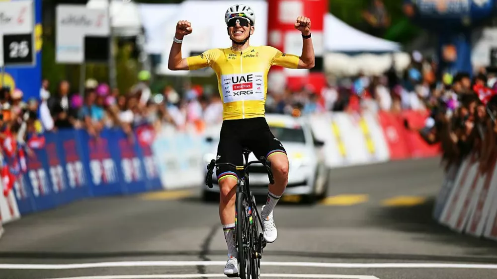 CHARMEY, SWITZERLAND - MAY 02: Tadej Pogacar of Slovenia and UAE Team Emirates - XRG - Yellow Leader Jersey celebrates at finish line as stage winner during the 79th Tour de Romandie 2026, Stage 4 a 149.6km stage from Broc to Charmey / #UCIWT / on May 02, 2026 in Charmey, Switzerland. (Photo by Dario Belingheri/Getty Images)