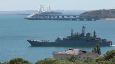 FILE - A Russian military ship transports cars and people from the Russian mainland to the Crimean Peninsula over the Kerch Strait on Monday, July 17, 2023. (AP Photo, File)