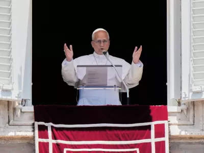 Pope Leo XIV delivers his blessing as he recites the Angelus noon prayer from the window of his studio overlooking St.Peter's Square, at the Vatican, Sunday, June 14, 2026. (AP Photo/Andrew Medichini)
