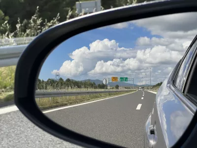 View of a modern highway in the rearview mirror of a passenger car (Zadar, Croatia) - Pogled na modernu autocestu u retrovizoru osobnog automobila (Zadar, Hrvatska)