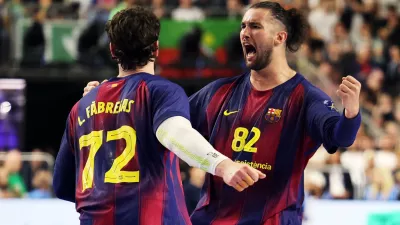 Handball - EHF FINAL4 Men's Handball Champions League Finals - Aalborg Handbold v Barca - Lanxess Arena, Cologne, Germany - June 13, 2026 Barca's Luis Frade celebrates with Ludovic Fabregas REUTERS/Leon Kuegeler