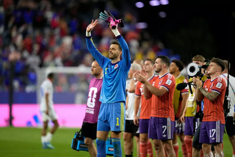 Scotland's goalkeeper Angus Gunn (1) celebrates a win following the World Cup Group C soccer match between Haiti and Scotland in Foxborough, Mass., near Boston, Saturday, June 13, 2026. (AP Photo/Charlie Krupa)