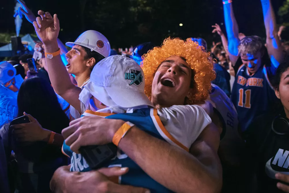 New York Knicks fans celebrate their victory as they watch Game 5 of the NBA Finals basketball series against the San Antonio Spurs, Saturday, June 13, 2026, in New York. (AP Photo/Andres Kudacki)