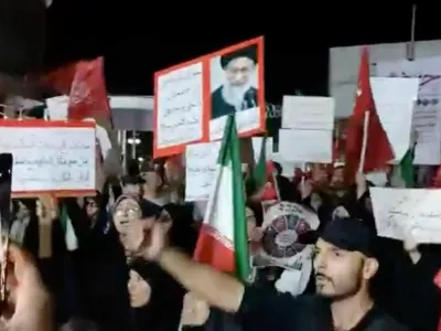 People take part in a protest ahead of an expected signing of an agreement to end the U.S.-Iran conflict, according to U.S. and Pakistani leaders, in Tehran, Iran, in this still image obtained from a social media video released on June 13, 2026. Social Media/via REUTERS THIS IMAGE HAS BEEN SUPPLIED BY A THIRD PARTY. NO RESALES. NO ARCHIVES. BEST QUALITY AVAILABLE. VERIFICATION: Building and columns matched file and satellite imagery. Coordinates of the square: 35.698960305108244, 51.43731924505487. Corroborating video showing people chanting the same slogan at the same location. Date not verified but no older versions of the footage were found posted online before June 13.