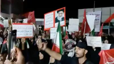 People take part in a protest ahead of an expected signing of an agreement to end the U.S.-Iran conflict, according to U.S. and Pakistani leaders, in Tehran, Iran, in this still image obtained from a social media video released on June 13, 2026. Social Media/via REUTERS THIS IMAGE HAS BEEN SUPPLIED BY A THIRD PARTY. NO RESALES. NO ARCHIVES. BEST QUALITY AVAILABLE. VERIFICATION: Building and columns matched file and satellite imagery. Coordinates of the square: 35.698960305108244, 51.43731924505487. Corroborating video showing people chanting the same slogan at the same location. Date not verified but no older versions of the footage were found posted online before June 13.