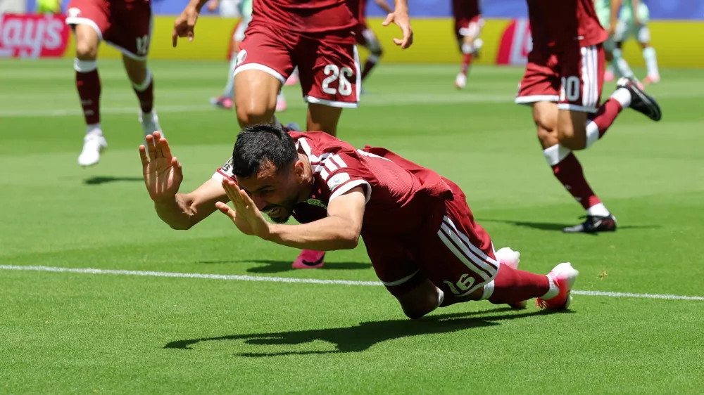 Soccer Football - FIFA World Cup 2026 - Group B - Qatar v Switzerland - San Francisco Bay Area Stadium, Santa Clara, California, U.S. - June 13, 2026 Qatar's Boualem Khoukhi celebrates scoring their first goal REUTERS/Carlos Barria   TPX IMAGES OF THE DAY