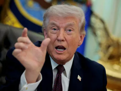 FILE PHOTO: U.S. President Donald Trump speaks during the signing ceremony for an executive order on mail ballots, in the Oval Office of the White House in Washington, D.C., March 31, 2026. REUTERS/Evan Vucci/File Photo