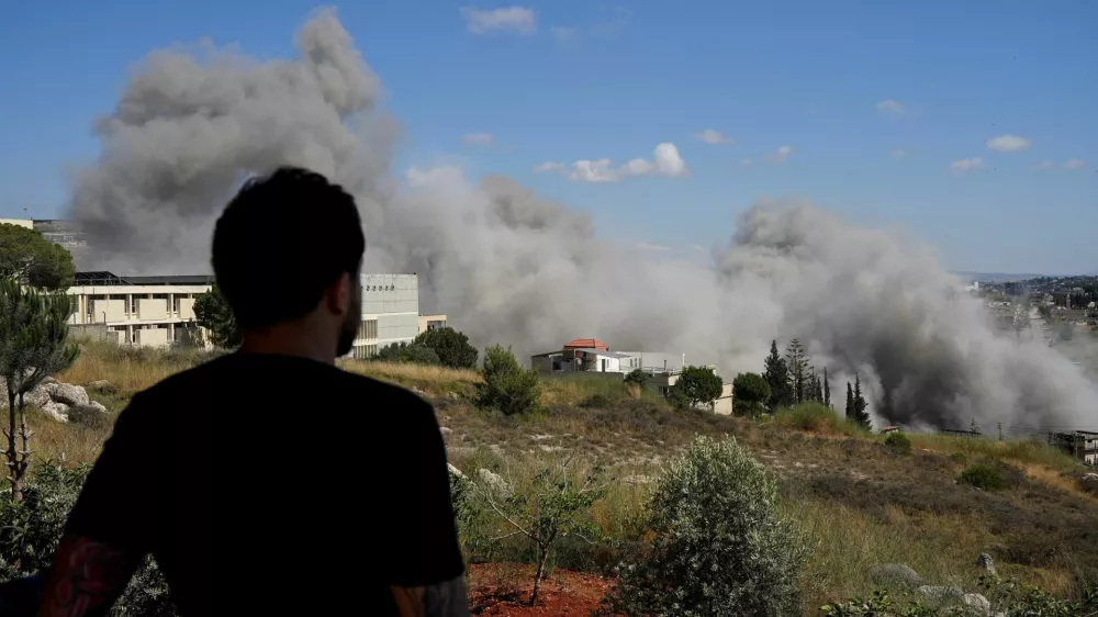Smoke billows from southern Lebanon following an Israeli strike, as seen from Nabatieh, Lebanon, June 13, 2026. REUTERS/Stringer
