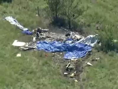 Wreckage lies in a field next to Butler Memorial Airport after a plane carrying skydivers crashed in Butler, Missouri, U.S., June 14, 2026 in a still image from video. ABC Affiliate KMBC via REUTERS. NO RESALES. NO ARCHIVES. THIS IMAGE HAS BEEN SUPPLIED BY A THIRD PARTY. MANDATORY CREDIT   TPX IMAGES OF THE DAY