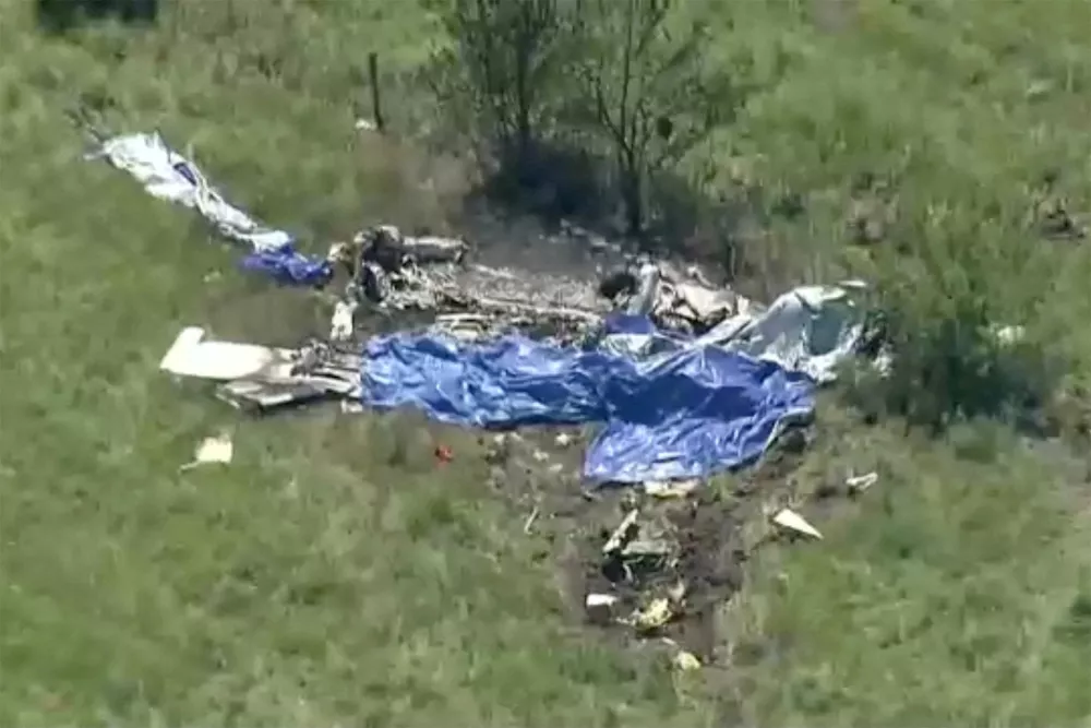 Wreckage lies in a field next to Butler Memorial Airport after a plane carrying skydivers crashed in Butler, Missouri, U.S., June 14, 2026 in a still image from video. ABC Affiliate KMBC via REUTERS. NO RESALES. NO ARCHIVES. THIS IMAGE HAS BEEN SUPPLIED BY A THIRD PARTY. MANDATORY CREDIT   TPX IMAGES OF THE DAY
