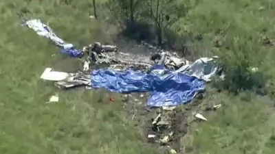 Wreckage lies in a field next to Butler Memorial Airport after a plane carrying skydivers crashed in Butler, Missouri, U.S., June 14, 2026 in a still image from video. ABC Affiliate KMBC via REUTERS. NO RESALES. NO ARCHIVES. THIS IMAGE HAS BEEN SUPPLIED BY A THIRD PARTY. MANDATORY CREDIT   TPX IMAGES OF THE DAY