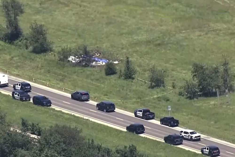 This video frame grab provided by KMBC-TV shows an aerial view of the crash scene near the Butler Memorial Airport in Butler, Mo., Sunday, June 14, 2026. (KMBC-TV via AP) CORRECTION: Crops photo to remove an erroneous source tag.
