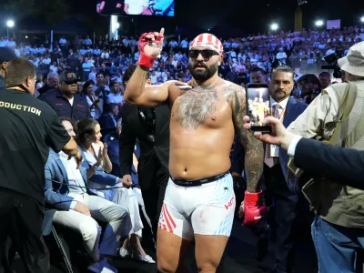 Josh Hokit leaves the ring after winning his fight against Derrick Lewis in a heavyweight bout during UFC Freedom 250 on the South Lawn of the White House, Sunday, June 14, 2026, in Washington. (AP Photo/Alex Brandon)