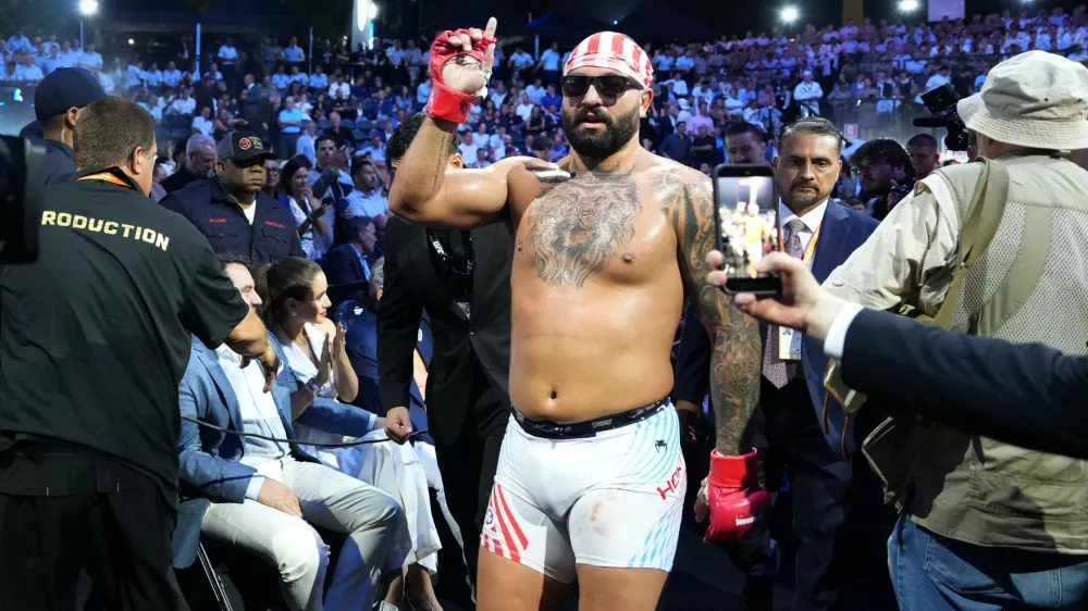 Josh Hokit leaves the ring after winning his fight against Derrick Lewis in a heavyweight bout during UFC Freedom 250 on the South Lawn of the White House, Sunday, June 14, 2026, in Washington. (AP Photo/Alex Brandon)
