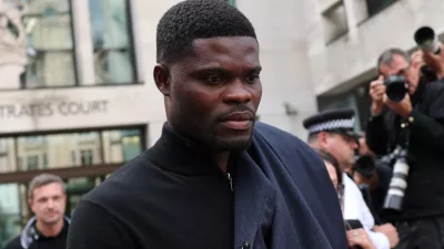 Former Arsenal player Thomas Partey, who has been charged with five counts of rape and one count of sexual assault, walks outside Westminster Magistrates' Court, in London, Britain, August 5, 2025. REUTERS/Hannah McKay