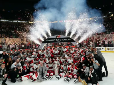 Jun 14, 2026; Las Vegas, Nevada, USA; The Carolina Hurricanes pose with the the Stanley Cup after defeating Vegas Golden Knights in game six of the 2026 Stanley Cup Final at T-Mobile Arena. Mandatory Credit: Stephen R. Sylvanie-Imagn Images   TPX IMAGES OF THE DAY