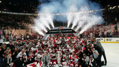 Jun 14, 2026; Las Vegas, Nevada, USA; The Carolina Hurricanes pose with the the Stanley Cup after defeating Vegas Golden Knights in game six of the 2026 Stanley Cup Final at T-Mobile Arena. Mandatory Credit: Stephen R. Sylvanie-Imagn Images   TPX IMAGES OF THE DAY