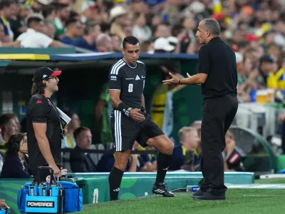 Tunisia head coach Sabri Lamouchi, right, reacts during the World Cup Group F soccer match between Sweden and Tunisia in Guadalupe, near Monterrey, Mexico, Sunday, June 14, 2026. (AP Photo/Moises Castillo)