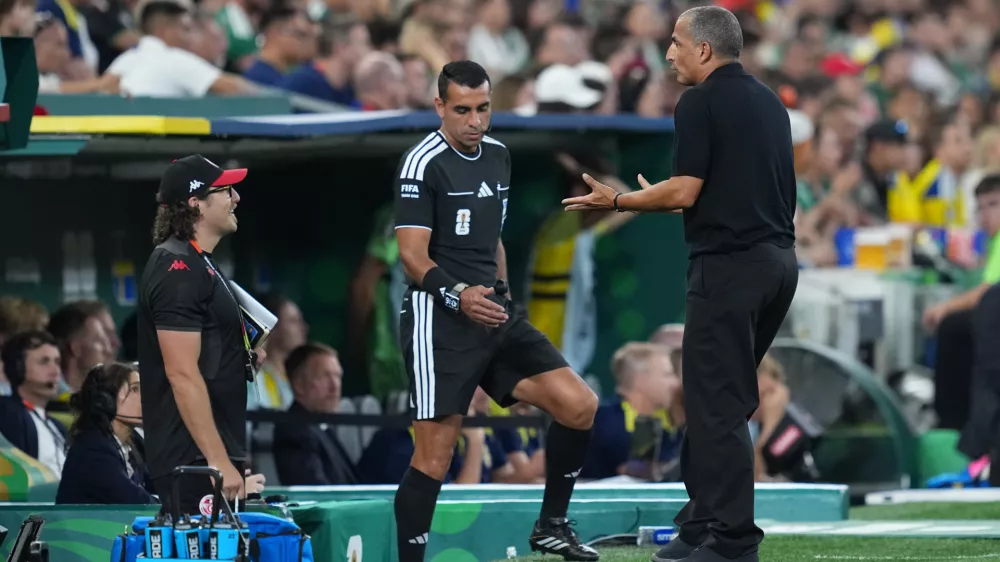 Tunisia head coach Sabri Lamouchi, right, reacts during the World Cup Group F soccer match between Sweden and Tunisia in Guadalupe, near Monterrey, Mexico, Sunday, June 14, 2026. (AP Photo/Moises Castillo)
