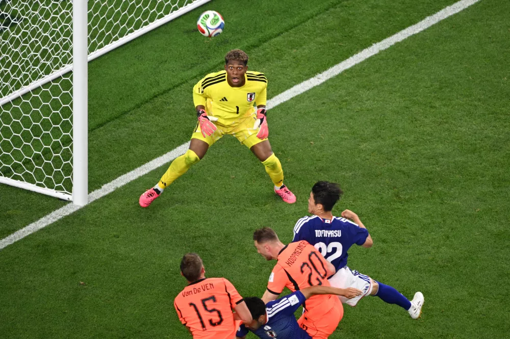 Japan goalkeeper Zion Suzuki (1) eyes the ball during the World Cup Group F soccer match between the Netherlands and Japan in Arlington, Texas, near Dallas, Sunday, June 14, 2026. (AP Photo/Jessica Tobias)