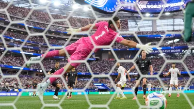 New Zealand goalkeeper Max Crocombe (1) is beaten by a header from Iran's Mohammad Mohebbi (8) to scores their second goal during the World Cup Group G soccer match between Iran and New Zealand in Inglewood, Calif., near Los Angeles, Monday, June 15, 2026. (AP Photo/Mark J. Terrill)
