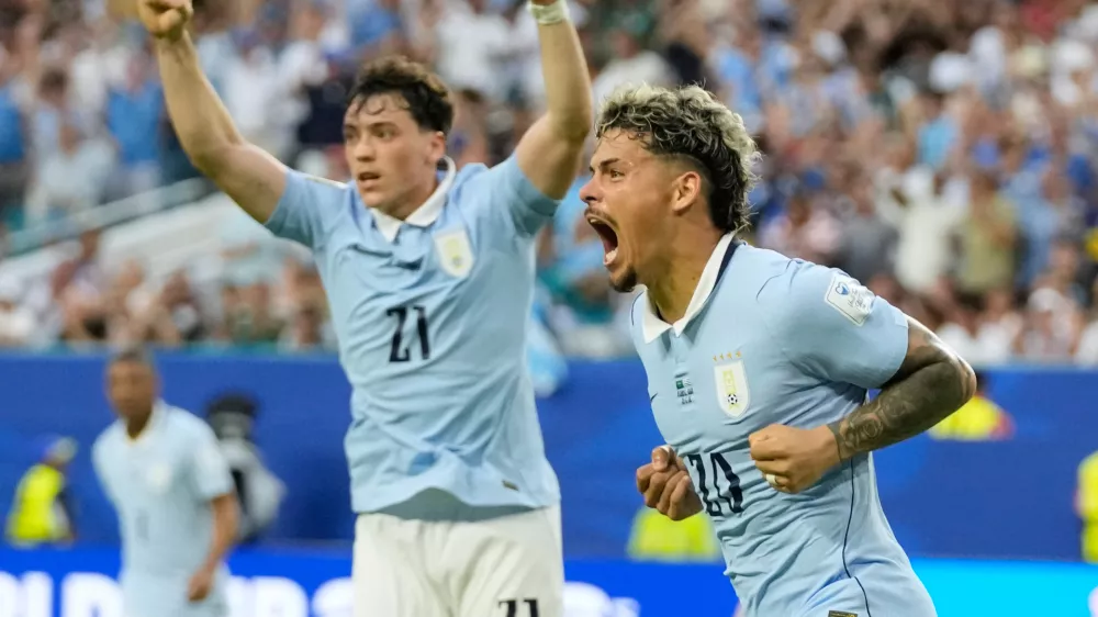 Uruguay's Maxi Araujo celebrates scoring his side's opening goal against Saudi Arabia during a World Cup Group H soccer match in Miami Gardens, Fla., Monday, June 15, 2026. (AP Photo/Lynne Sladky)