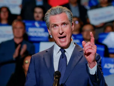 FILE PHOTO: California Governor Gavin Newsom, along with local congressional representatives, state officials and supporters, speaks as he announces the redrawing of California's congressional maps, calling on voters to approve a ballot measure, in response to a similar move in Texas being supported by U.S. President Donald Trump, in Los Angeles, California, U.S., August 14, 2025. REUTERS/Mike Blake/File Photo