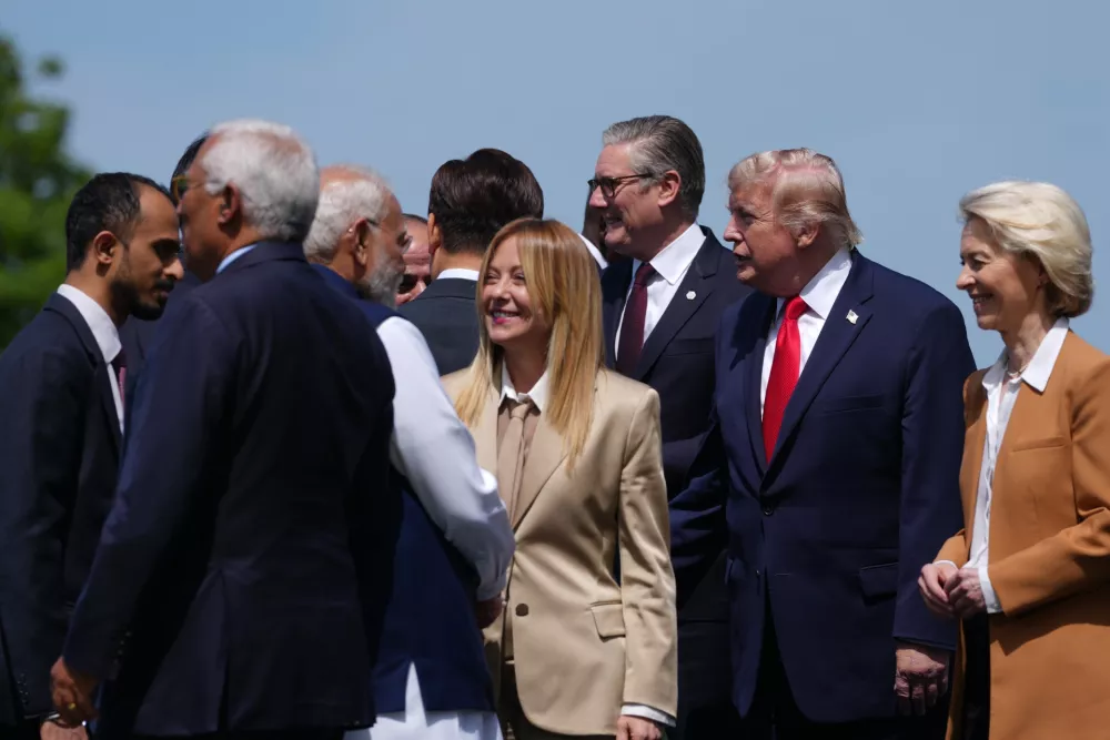 From right, European Commission President Ursula von der Leyen, U.S. President Donald Trump, British Prime Minister Keir Starmer, Italian Prime Minister Giorgia Meloni and India's Prime Minister Narenda Modi during a group photo of G7 leaders and invited nations during the G7 summit in Evian-les-Bains, France, Tuesday, June 16, 2026. (AP Photo/Thibault Camus)