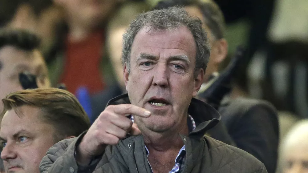 FILE - This is a Wednesday, March 11, 2015 file photo of TV host Jeremy Clarkson as he gestures as he takes his place in the stands before the Champions League round of 16 second leg soccer match between Chelsea and Paris Saint Germain at Stamford Bridge stadium in London. The BBC said Wednesday March 25, 2015 that it has decided not to renew the contract of "Top Gear'' host Jeremy Clarkson after a fracas with his producer. (AP Photo/Matt Dunham, File)